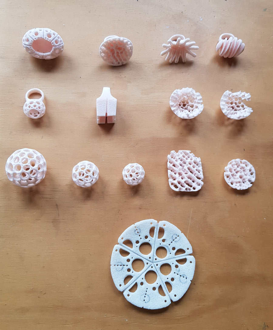 Carved models of rings and pendants, ready to be cast